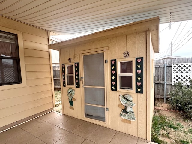 doorway to property with fence