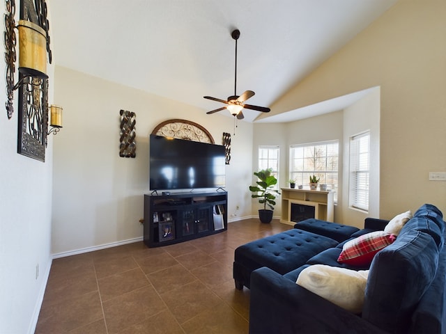 tiled living room with lofted ceiling and ceiling fan