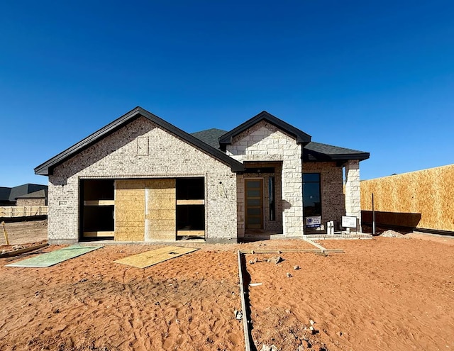 unfinished property with a garage