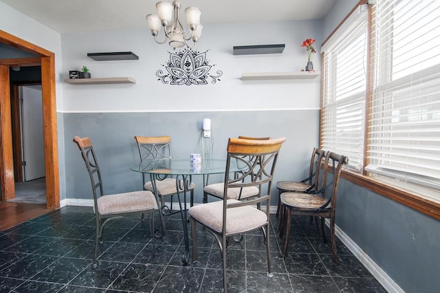 dining room with a chandelier