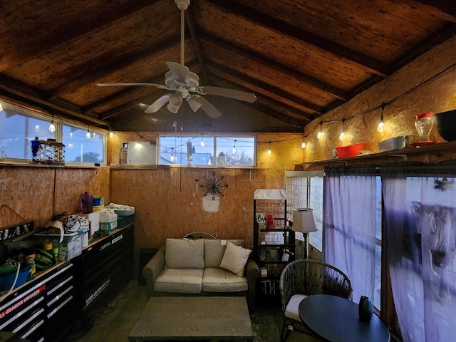 living room with lofted ceiling with beams, ceiling fan, wooden ceiling, and wooden walls