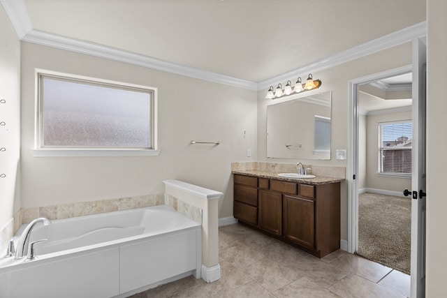 bathroom featuring a bathing tub, vanity, and crown molding