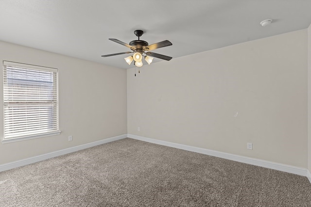 empty room featuring carpet flooring and ceiling fan