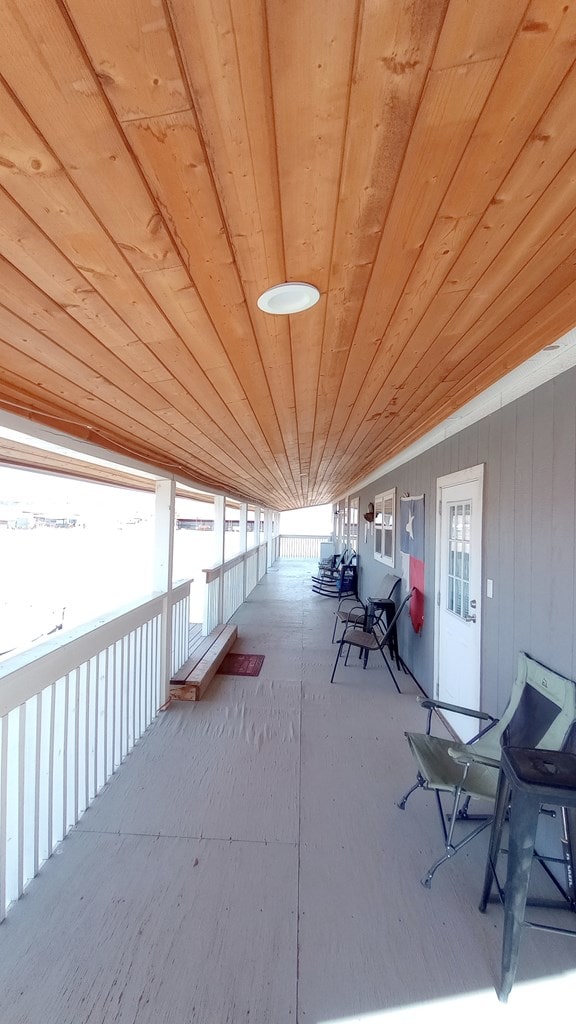 interior space featuring wooden ceiling and lofted ceiling