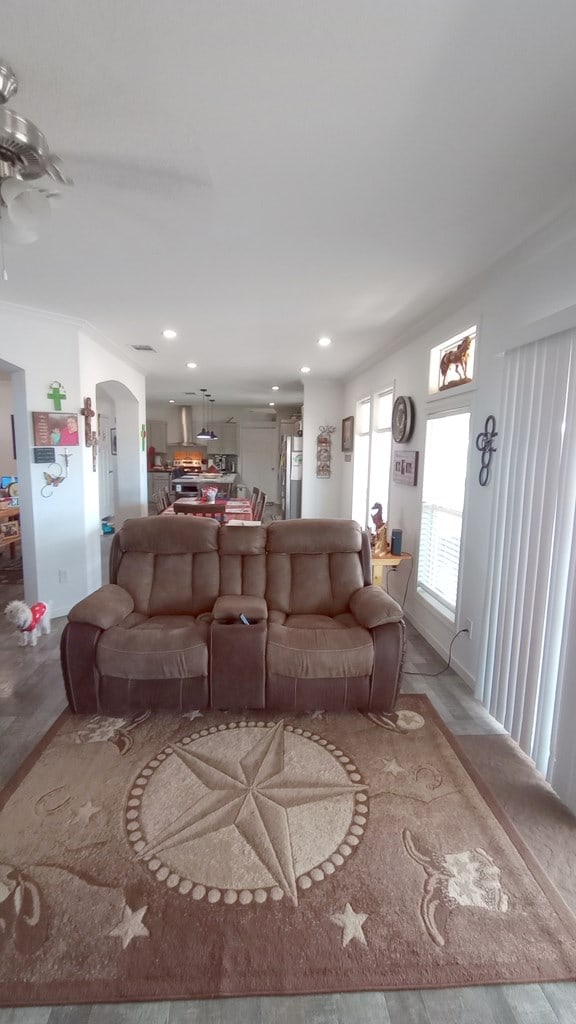 living room featuring hardwood / wood-style floors and ornamental molding