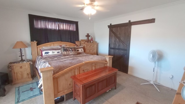 bedroom with a barn door, ceiling fan, crown molding, and light carpet