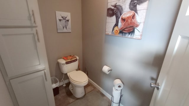 bathroom with tile patterned flooring and toilet