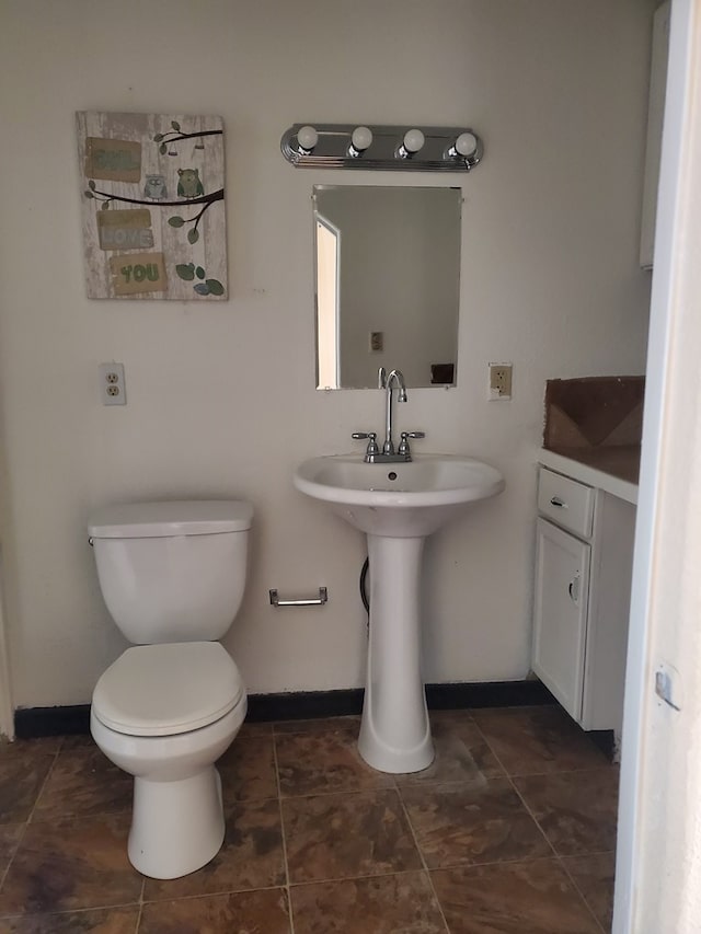 bathroom featuring sink and toilet