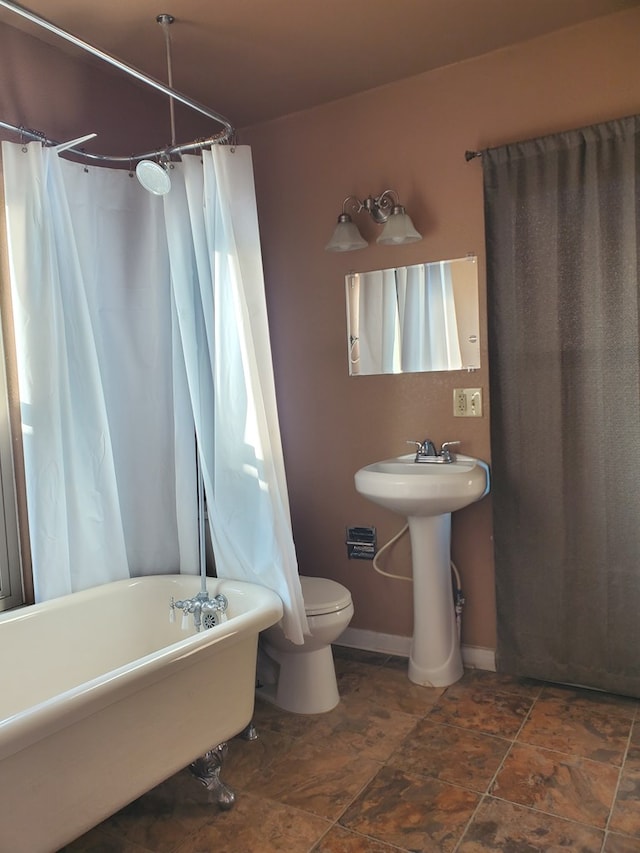 bathroom featuring sink and toilet