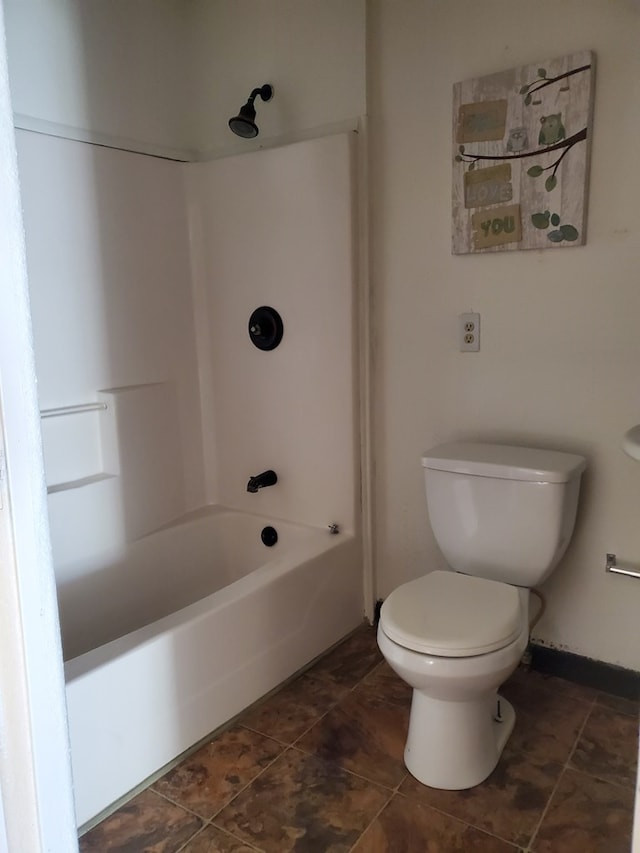 bathroom with tile patterned floors,  shower combination, and toilet