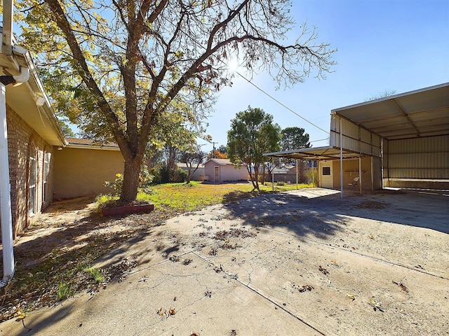 view of yard featuring a carport