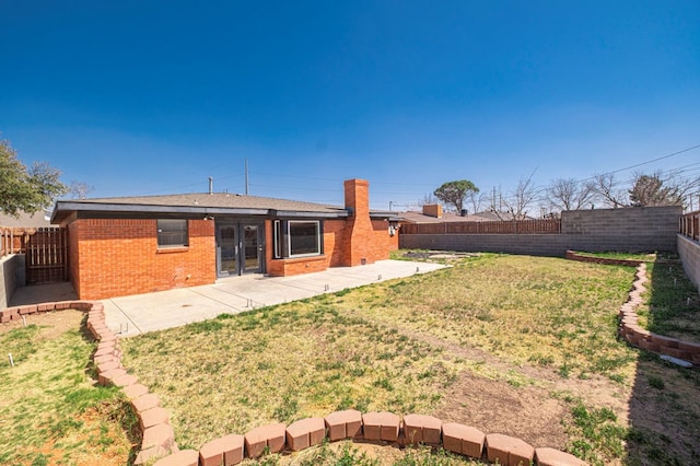 view of yard featuring a patio and a fenced backyard