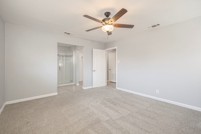 unfurnished bedroom featuring a ceiling fan, baseboards, visible vents, and light carpet