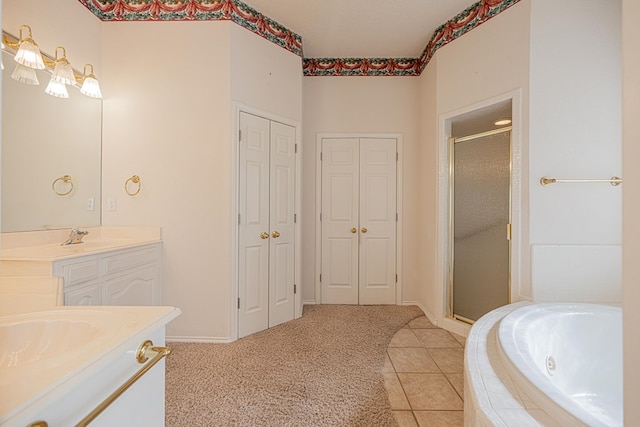 bathroom with tile patterned floors, vanity, and plus walk in shower