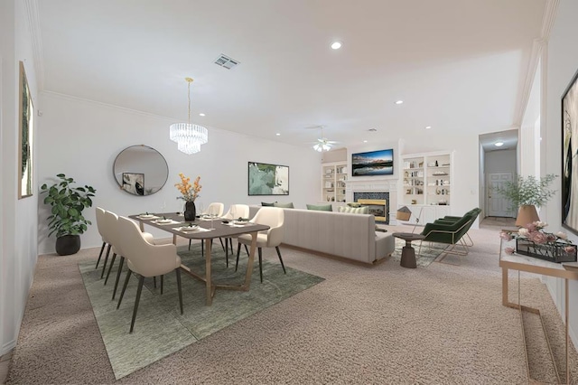 carpeted dining space featuring crown molding, ceiling fan with notable chandelier, and built in features