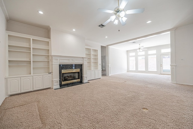 unfurnished living room with crown molding, carpet, and a fireplace