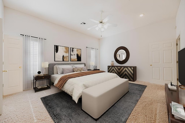 bedroom featuring light colored carpet and ceiling fan