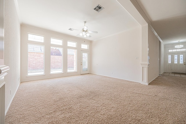 interior space with crown molding, a healthy amount of sunlight, and light carpet