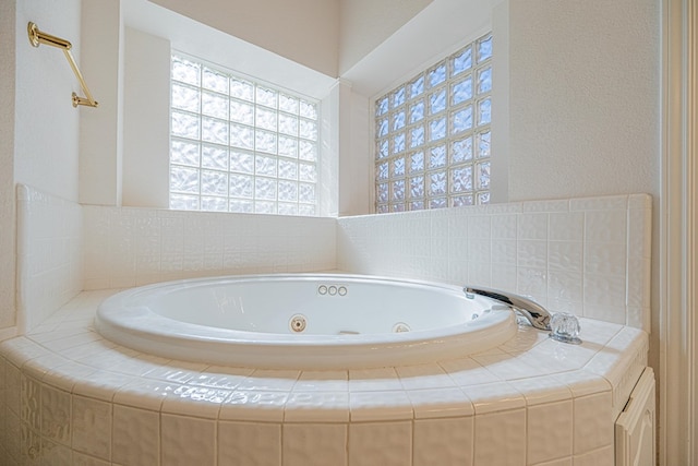 bathroom with tiled tub