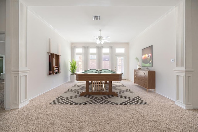 recreation room with crown molding, pool table, light carpet, ceiling fan, and decorative columns