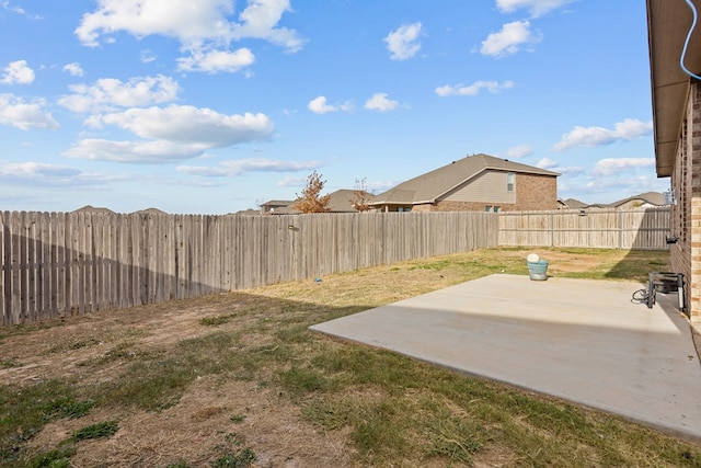 view of yard featuring a patio area and a fenced backyard