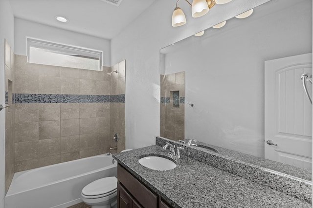 full bathroom featuring shower / bath combination, vanity, and toilet