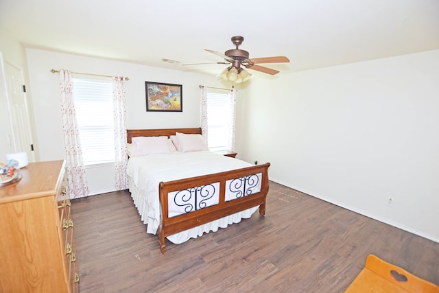 bedroom featuring dark hardwood / wood-style floors and ceiling fan