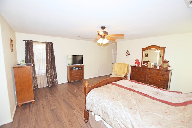 bedroom with dark wood-type flooring and ceiling fan