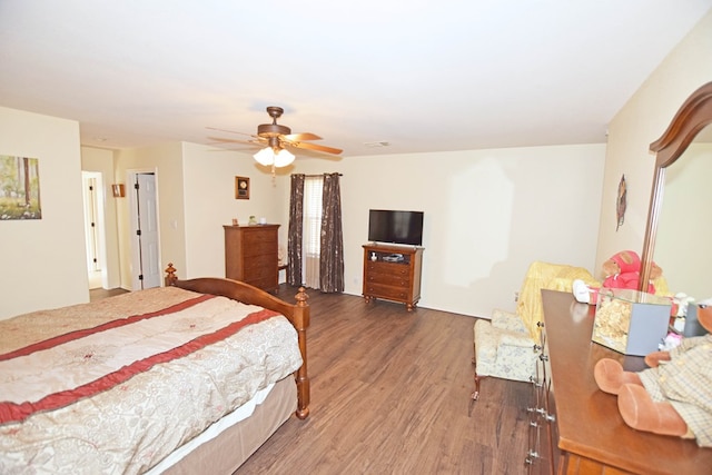 bedroom featuring ceiling fan and dark hardwood / wood-style floors