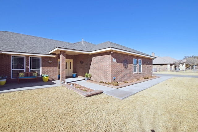 rear view of house with a lawn