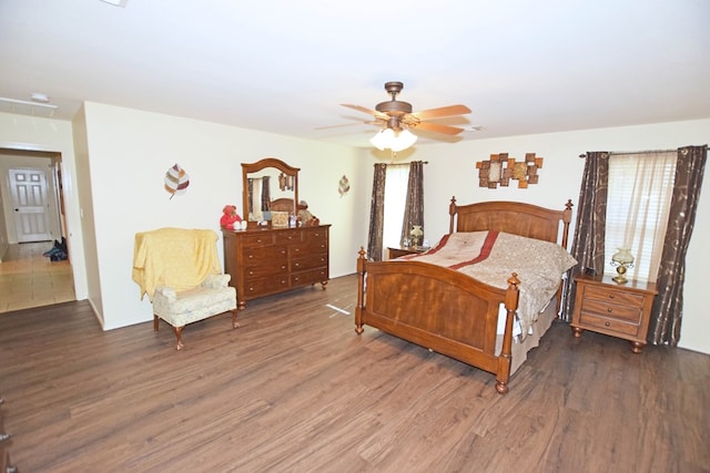 bedroom featuring dark wood-type flooring and ceiling fan