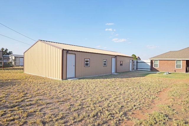 back of property featuring a lawn