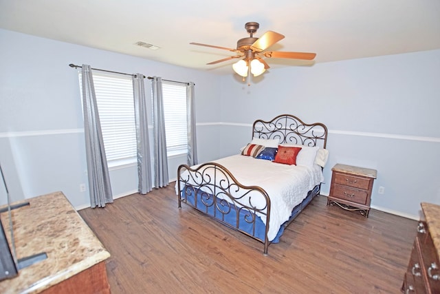 bedroom featuring dark wood-type flooring and ceiling fan