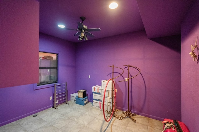 interior space with ceiling fan