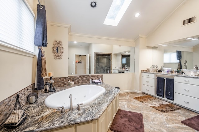 bathroom with vanity, independent shower and bath, crown molding, and vaulted ceiling with skylight