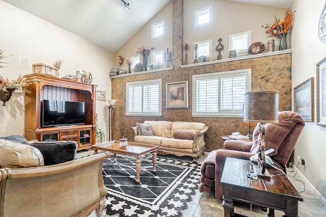 living room with high vaulted ceiling