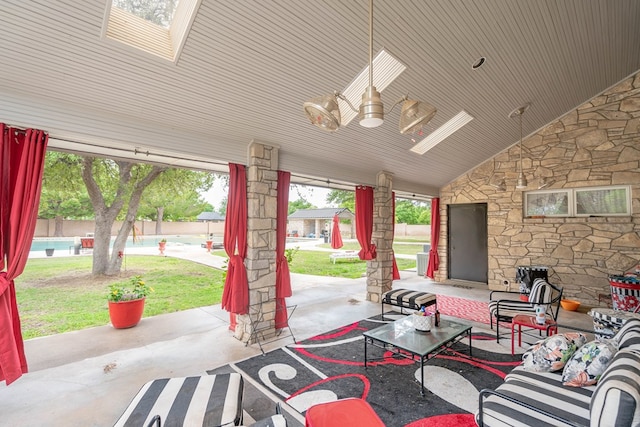 view of patio with a pool and ceiling fan