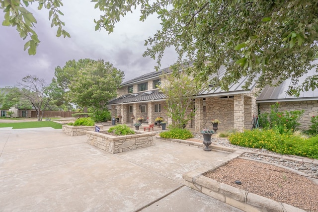 rear view of property with a patio area