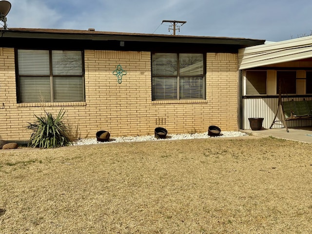 view of front of home featuring brick siding