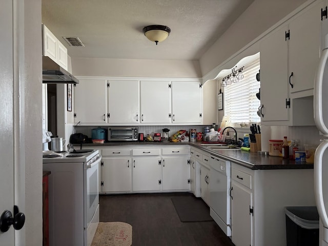 kitchen with visible vents, electric range, white dishwasher, a sink, and dark countertops