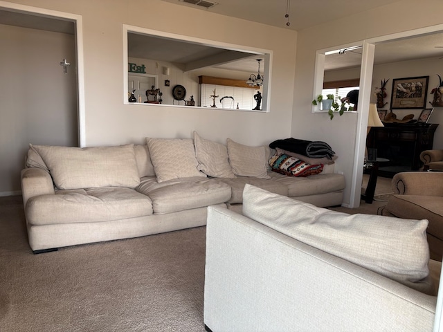 living area with carpet and visible vents