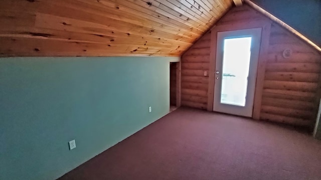 additional living space with rustic walls, wooden ceiling, and vaulted ceiling