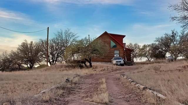 view of property exterior at dusk