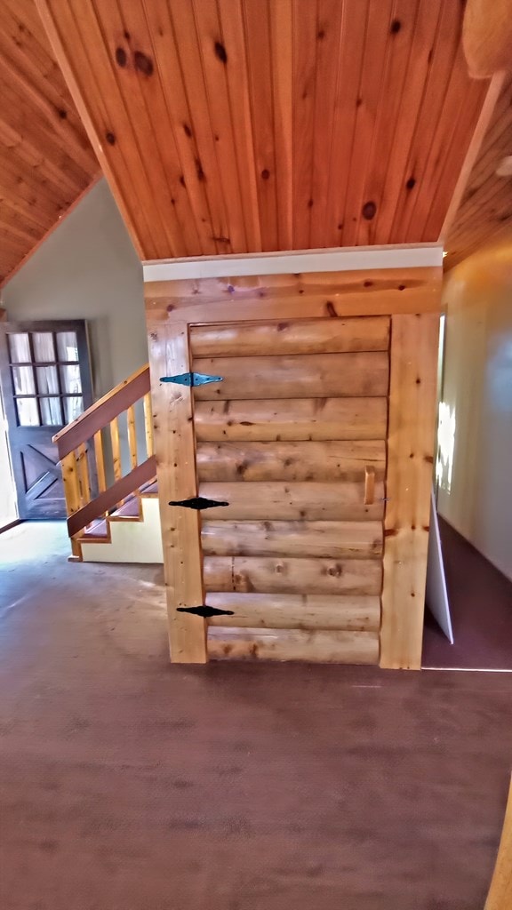 additional living space featuring wood ceiling and vaulted ceiling