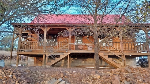 back of property featuring a wooden deck