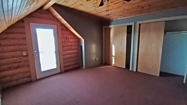 bonus room with lofted ceiling, ceiling fan, wooden ceiling, and log walls