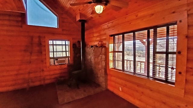 interior space with ceiling fan, cooling unit, and wood ceiling