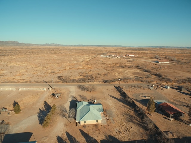 birds eye view of property with a rural view