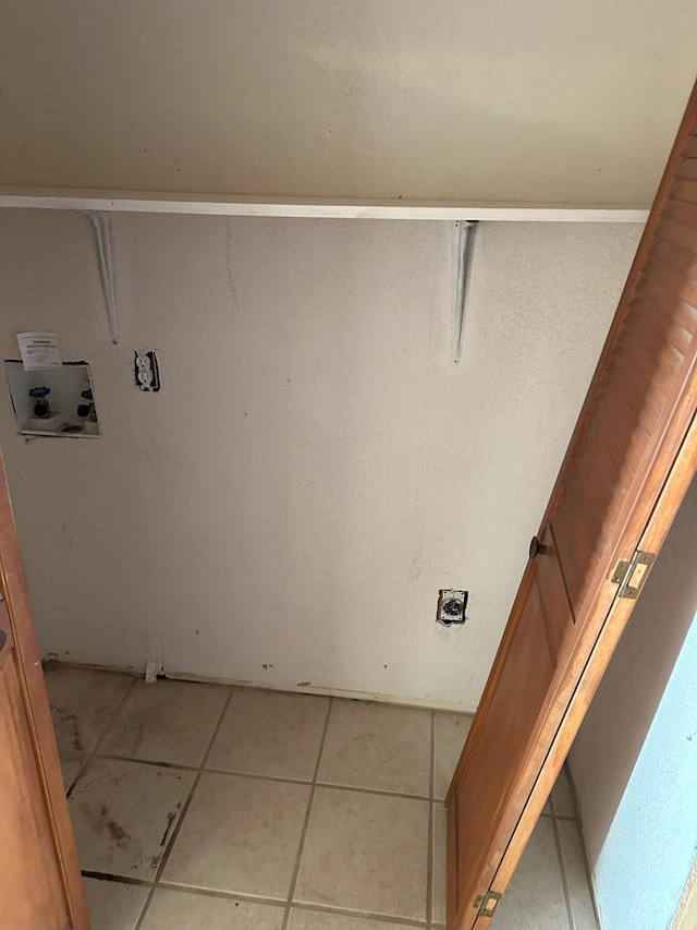 laundry room with washer hookup, light tile patterned floors, and electric dryer hookup