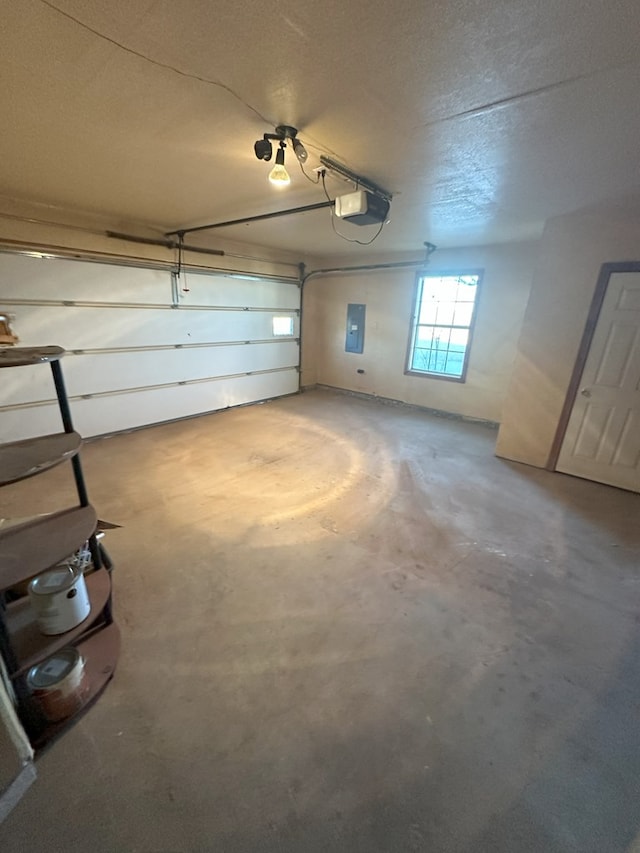 garage featuring a garage door opener and electric panel